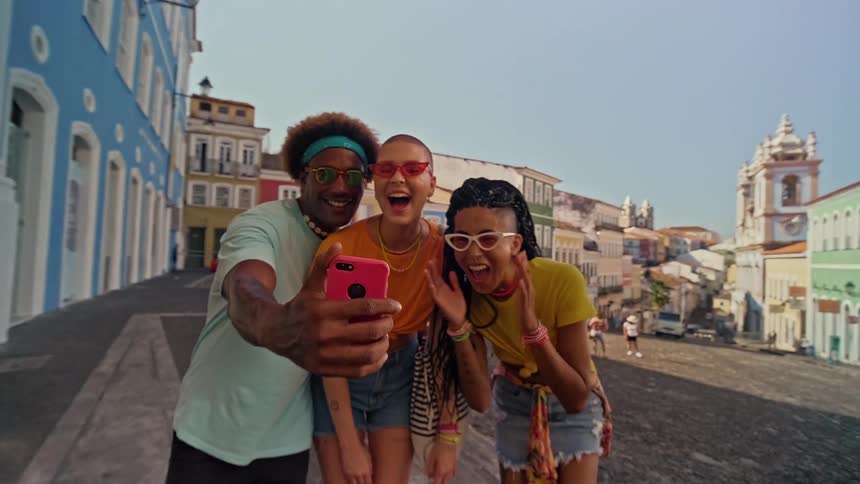 Man and two women taking a selfie