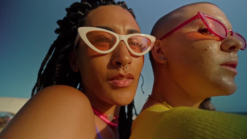 Portrait of two women with sunglasses outdoors