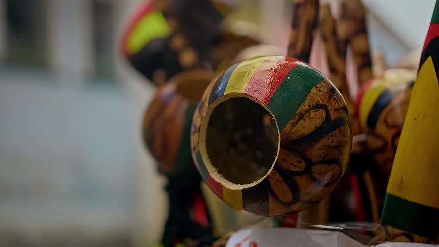 Close up of a collection of painted calabashes outdoors during daytime