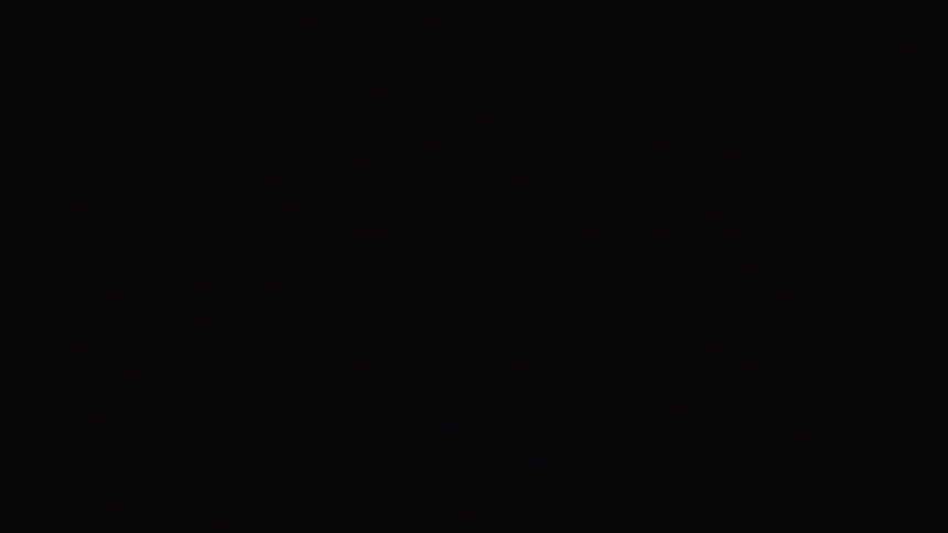 Screen displaying colored lights in a dark room