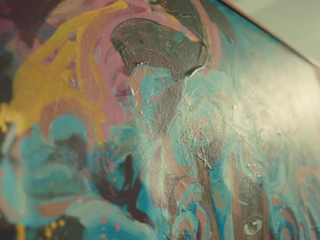 Close up of a multicoloured art painting in a room during daytime