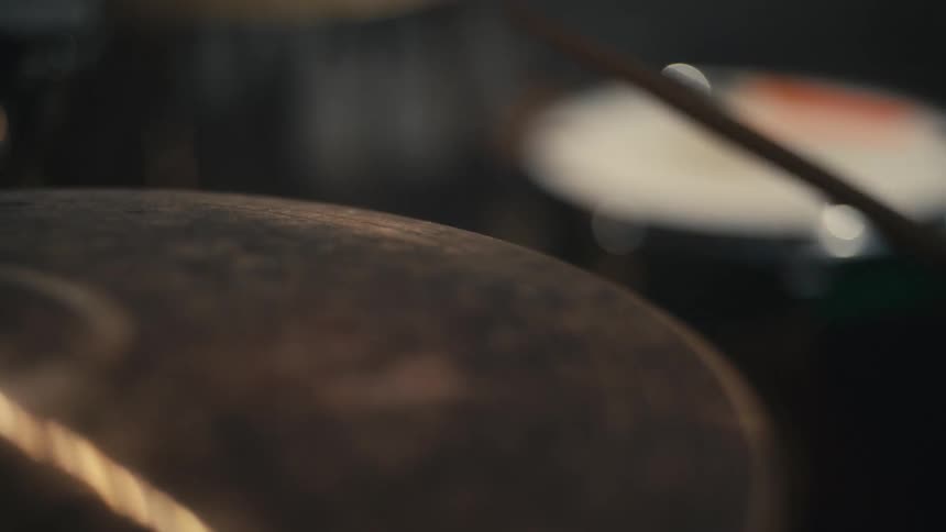 A drummer playing the drum set at a concert