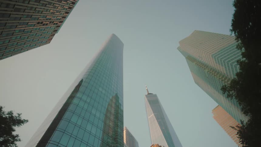 Skyscrapers rise against a clear sky in an urban setting
