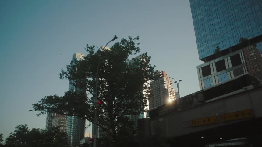 Tall skyscrapers tower under a clear sky in the city