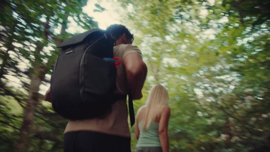 Man and a woman hiking in a forest