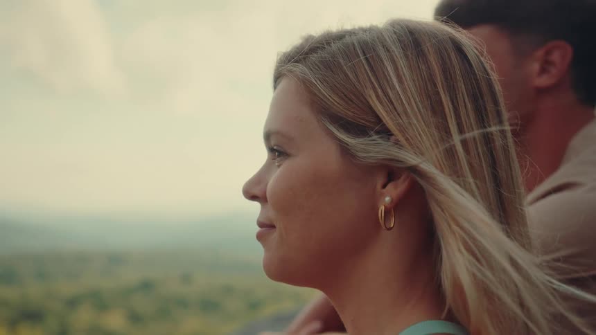 Woman and a man enjoying a landscape