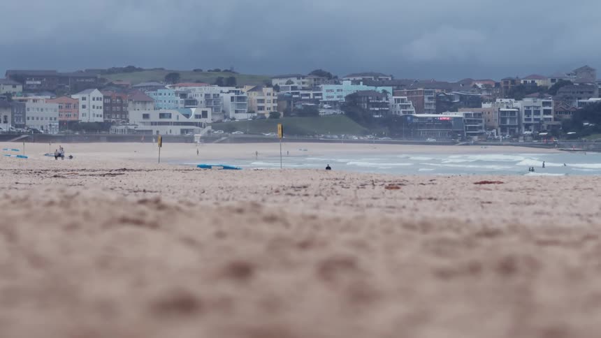 Landscape of a beach with houses on the coast in the background