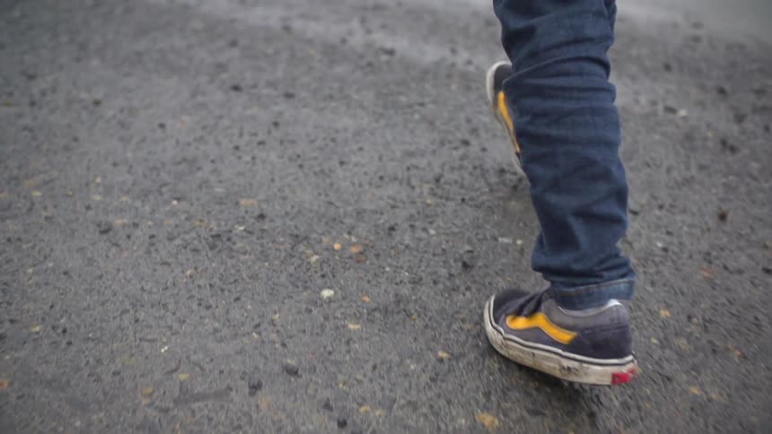 Person walking the wet ground