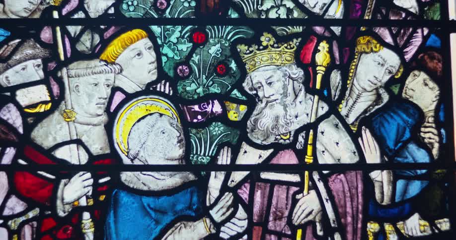 Close up of an ancient multicoloured painting on a glass window