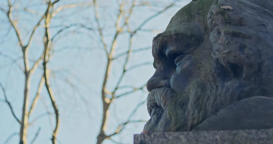 A bust of a head is made of stone