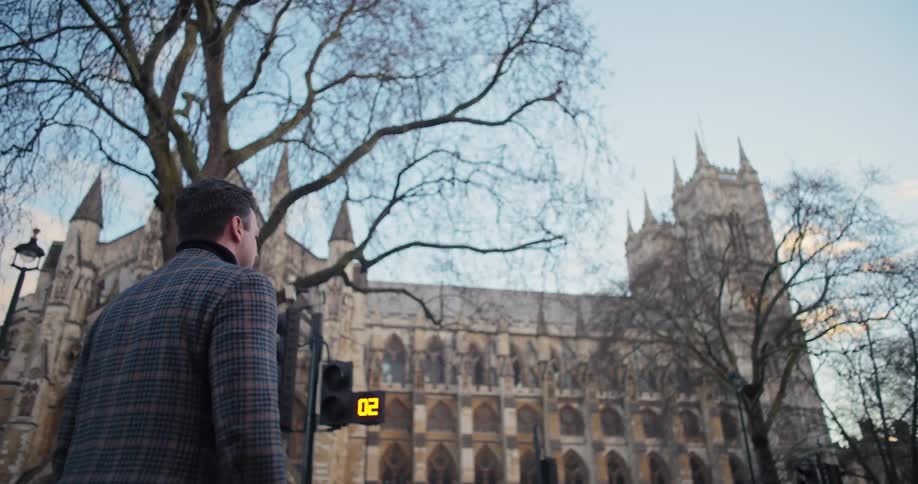 People are walking towards the large church