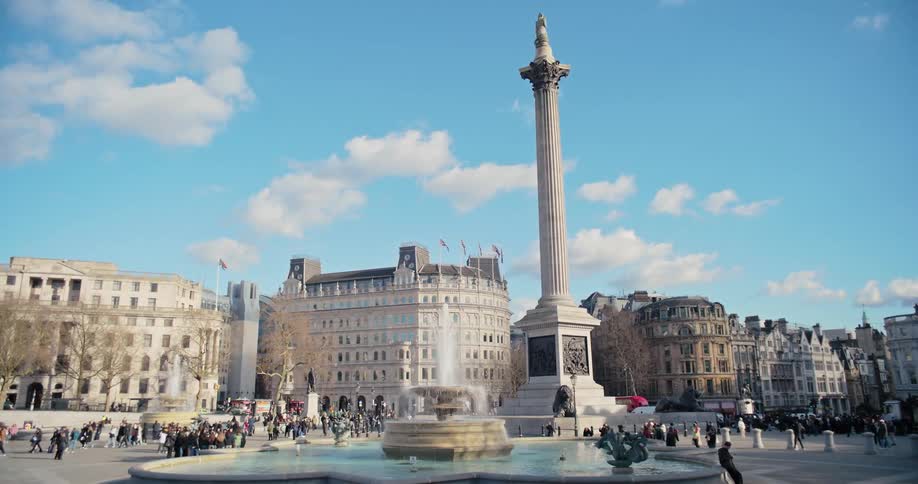 Pedestrians walk around the fountain