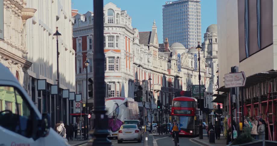 Traffic and pedestrians travel through the city