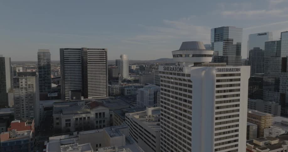 A city skyline view with a series of highrise buildings towers and skyscrapers at midday