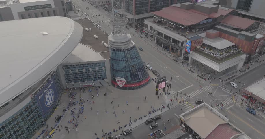 Aerial of a busy intersection beside a sport stadium in a metropolitan city during daytime