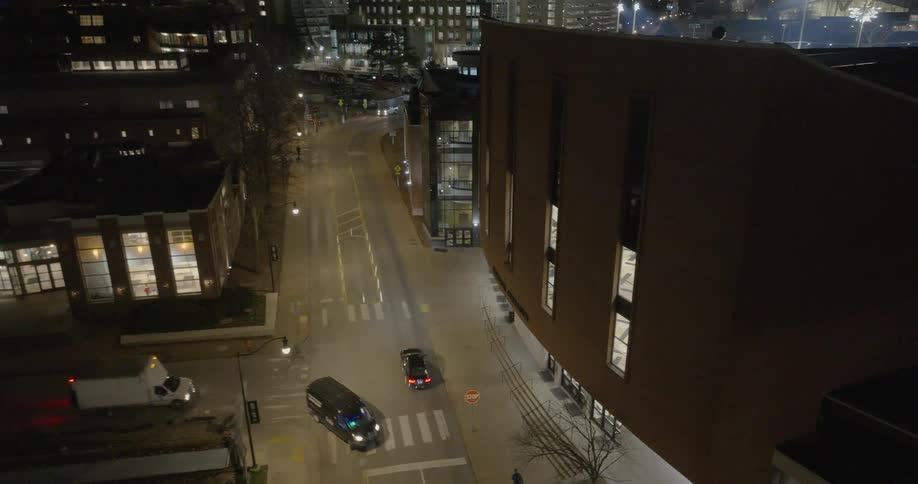 Aerial of a busy street intersection in a metropolitan city at night