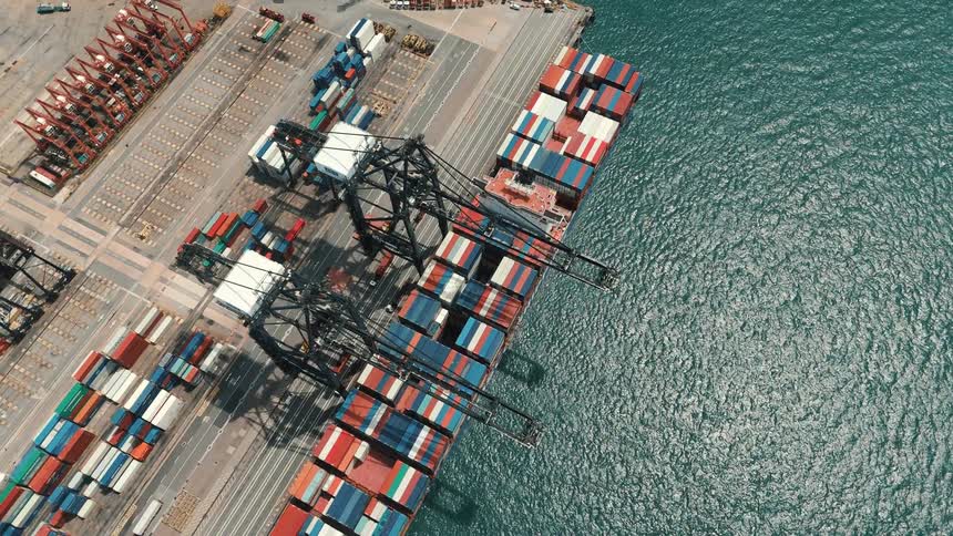 Aerial view of a container ship being loaded at a port terminal