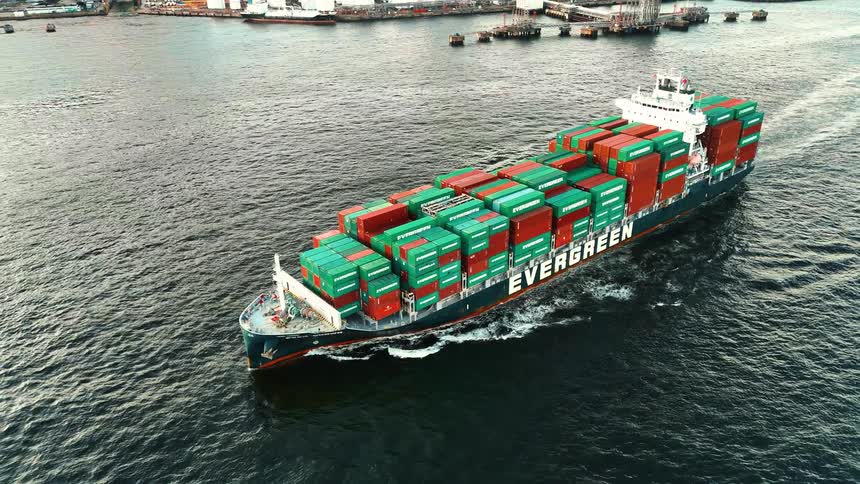 Evergreen container ship sailing loaded with green and red containers