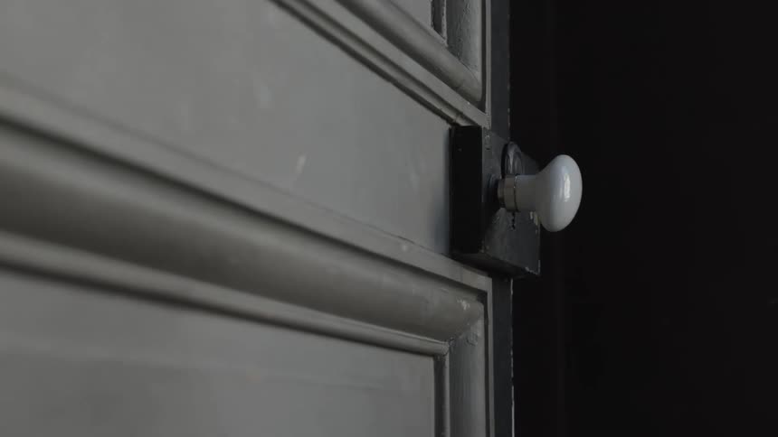 Closeup of a door opening with the handle in focus