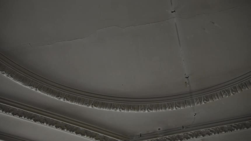 Cracks stretch to the ceiling medallions