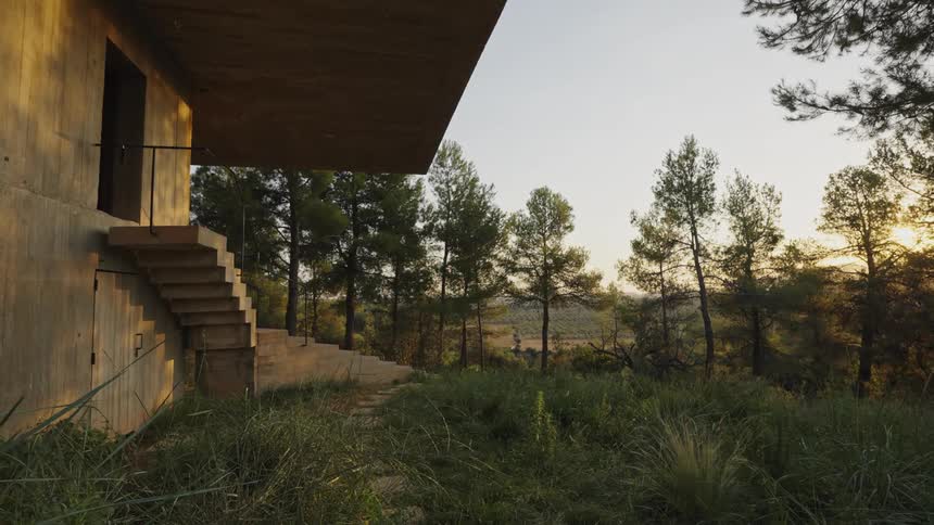 A building in a suburban region with outdoor stairs surrounded by trees popularly known as solo pezo house