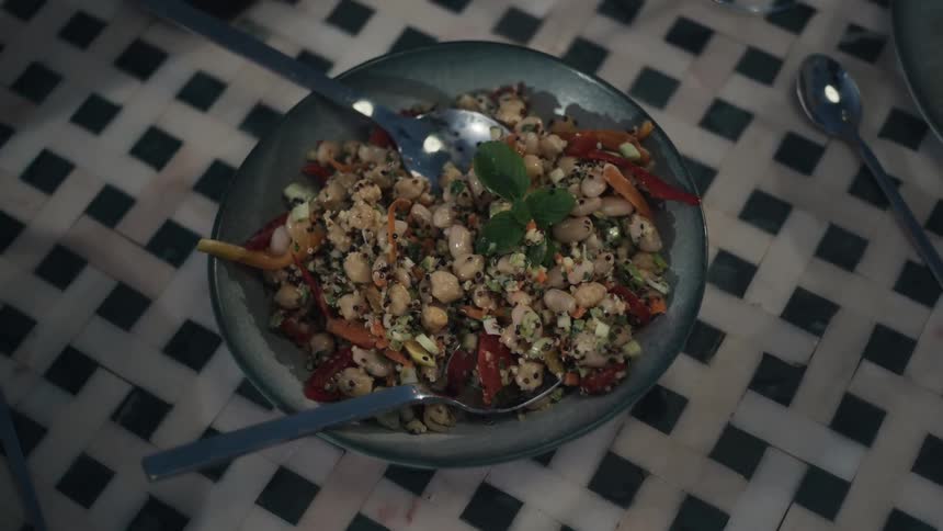 A bowl of quinoa is stirred