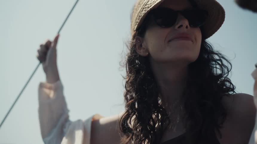 A man and woman ride on the boat