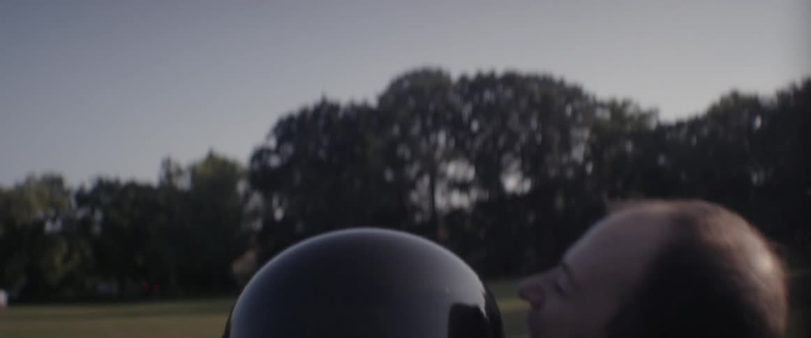 A man throws a girl wearing a spacesuit into the air