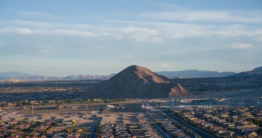 A mountain high above a suburban area