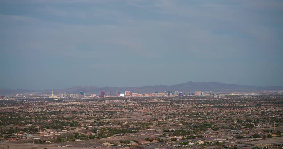 A long low landscape dotted with houses