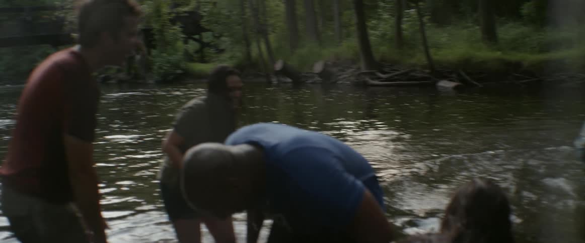 People are laughing and playing in the water