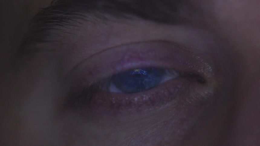 Abstract bright blue light in a persons eye