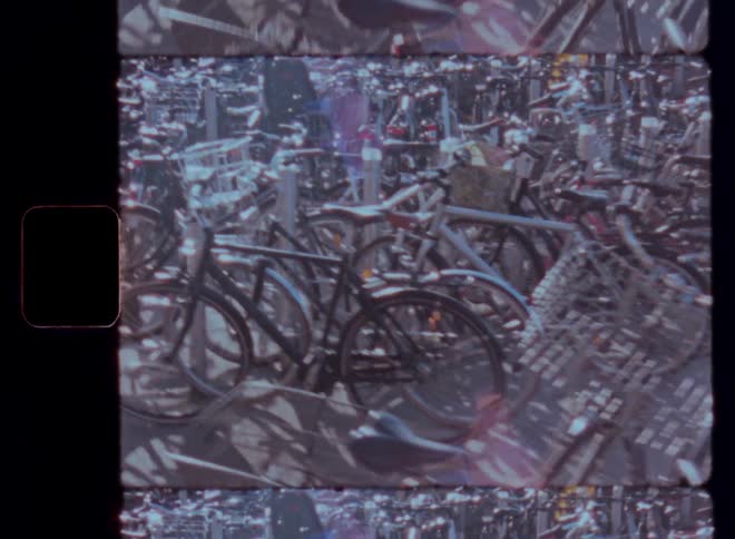 Large number of bicycles parked in an urban area