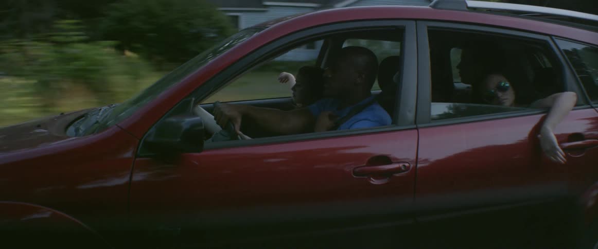 People are talking as they ride in a car