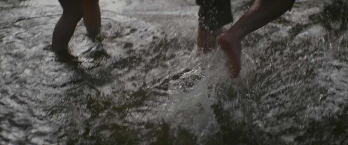 People jump into the water splashing around