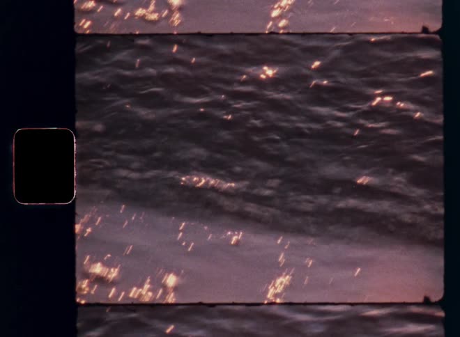 Close up of sea water flowing up against the shore during daytime