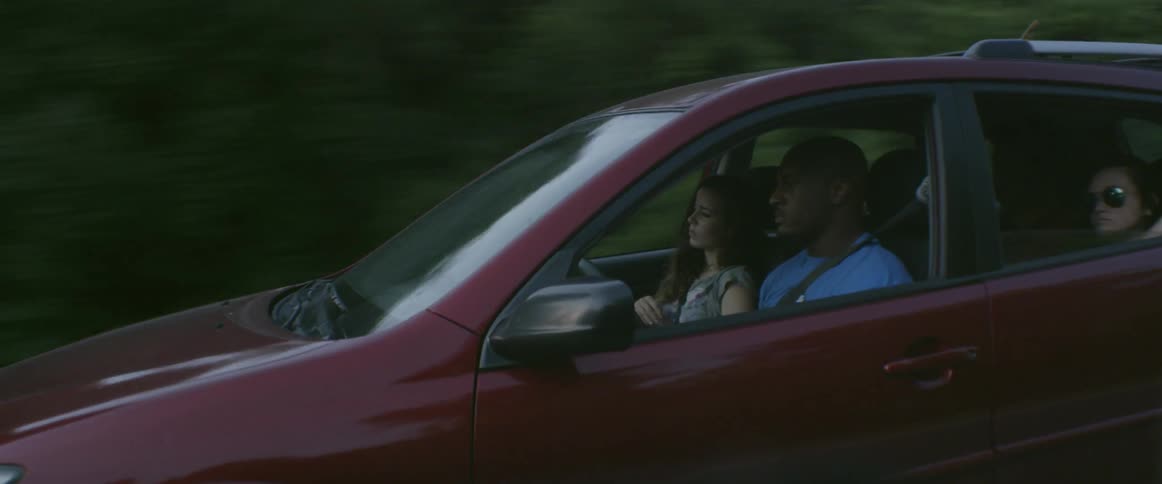People ride in a car together