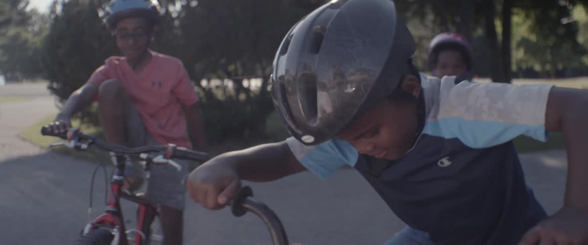 Children ride bicycles in a residential area
