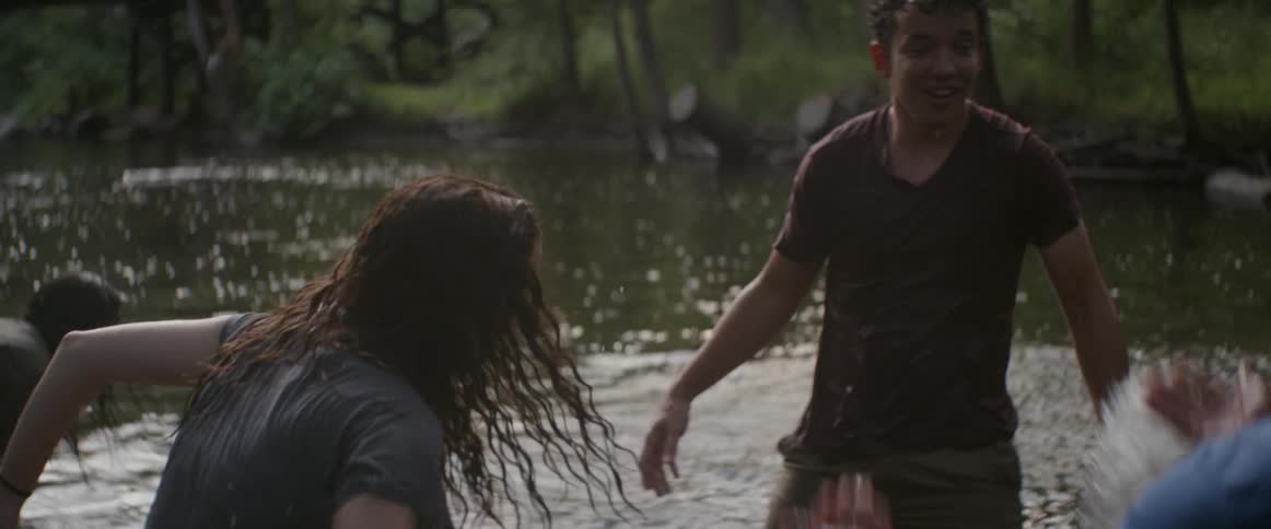 People play and splash in the lake together