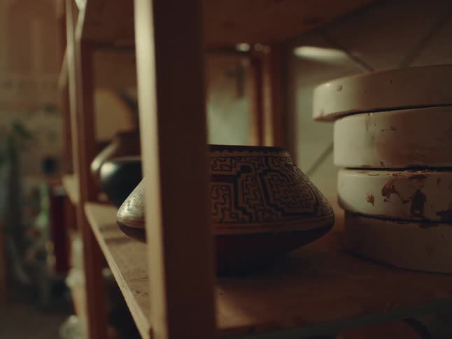 Handmade bowls on a wooden shelf