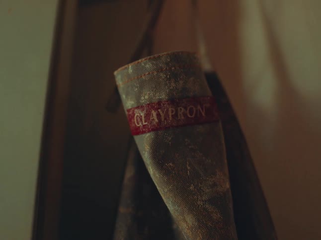A dirty apron is hanging in the room