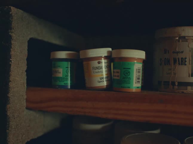 A few pill bottles on a shelf