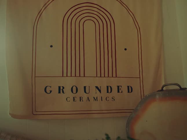 A sign that reads grounded ceramics