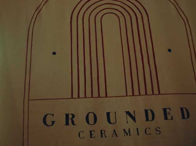A sheet of paper that reads grounded ceramics