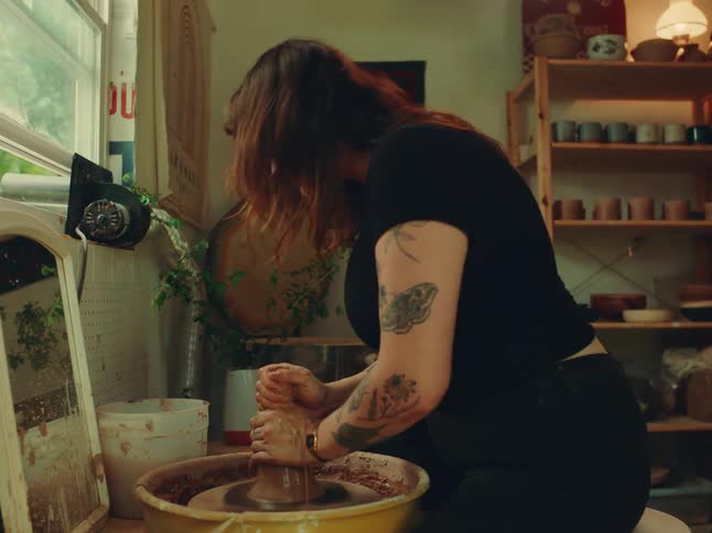 Woman working with clay