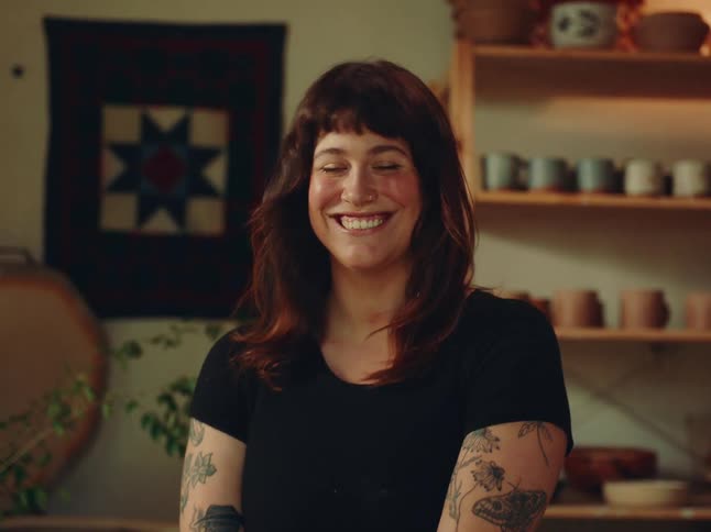 Woman smiling towardsin a cozy room