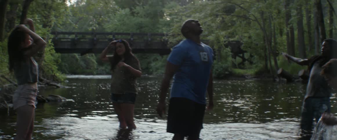 People in the water splash around
