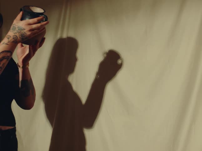 A woman is examining a vase