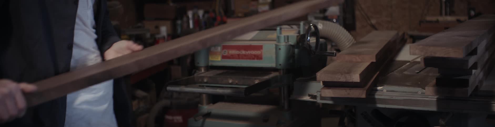 A man turns the knob on a machine