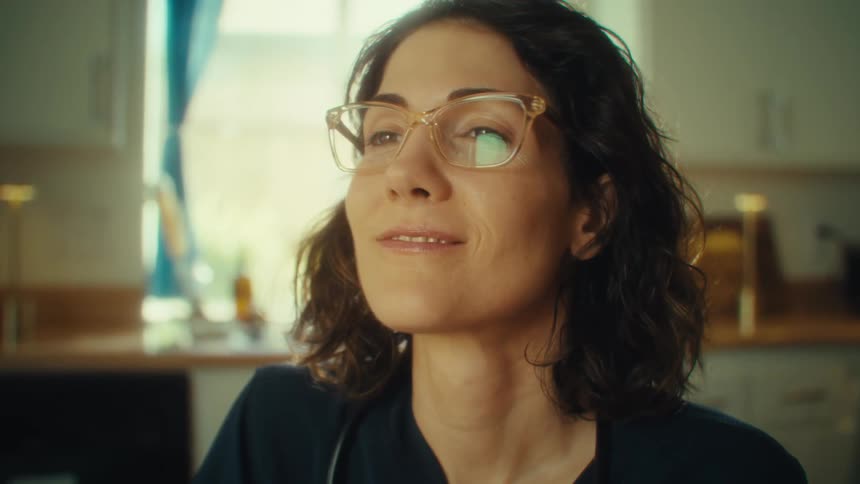 Thoughtful woman with glasses